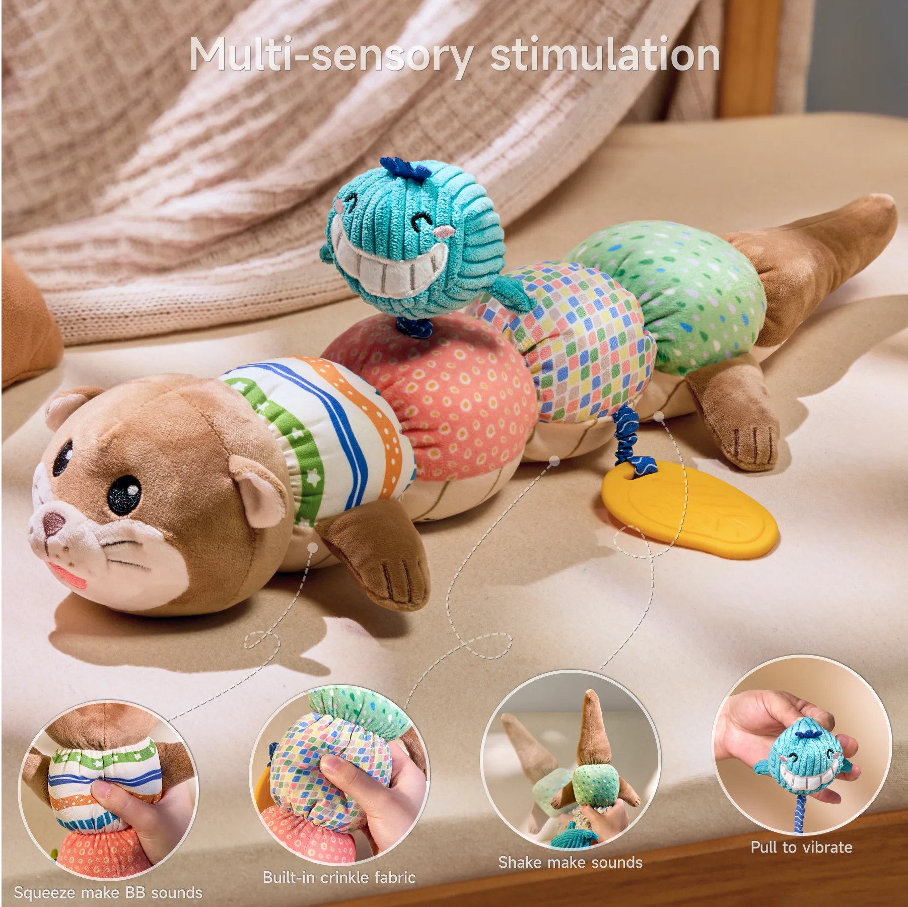 Detailed product showcase of a multi-sensory otter toy displayed on a beige surface against a soft knitted background. The title 'Multi-sensory stimulation' appears at the top. The main image shows the full toy with a cute brown otter head featuring embroidered whiskers and eyes at one end, a tail at the other, and five colorful textured segments in between (striped, pink with circles, multicolored squares, and green dots).