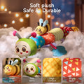 Soft, colorful plush patchwork caterpillar toy lying on fluffy white padding with an attached smiling bee and teether, accompanied by inset detail panels showing its short plush fur, soft fabric segments, high-contrast patterns, and bright colors