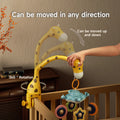A hand adjusts a yellow giraffe-shaped crib mobile attached to the side of a wooden crib. The mobile features colorful hanging toys shaped like stars and moons. The image shows that the giraffe neck can move up and down and rotate 360 degrees for flexible positioning. White overlay text reads “Can be moved in any direction,” “Can be moved up and down,” and “360° Rotation.”