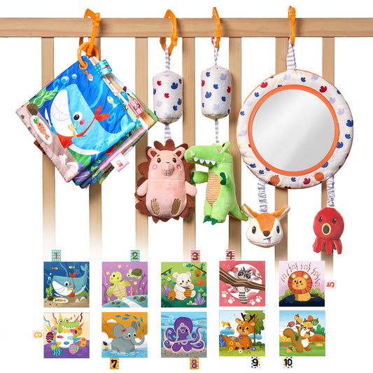A colorful baby sensory toy set hanging from a rope, featuring a plush hedgehog, a soft mirror, a red octopus, a bunny head, a fabric baby book with ocean animals, and a green alligator plush, each suspended with patterned fabric straps and orange hooks.