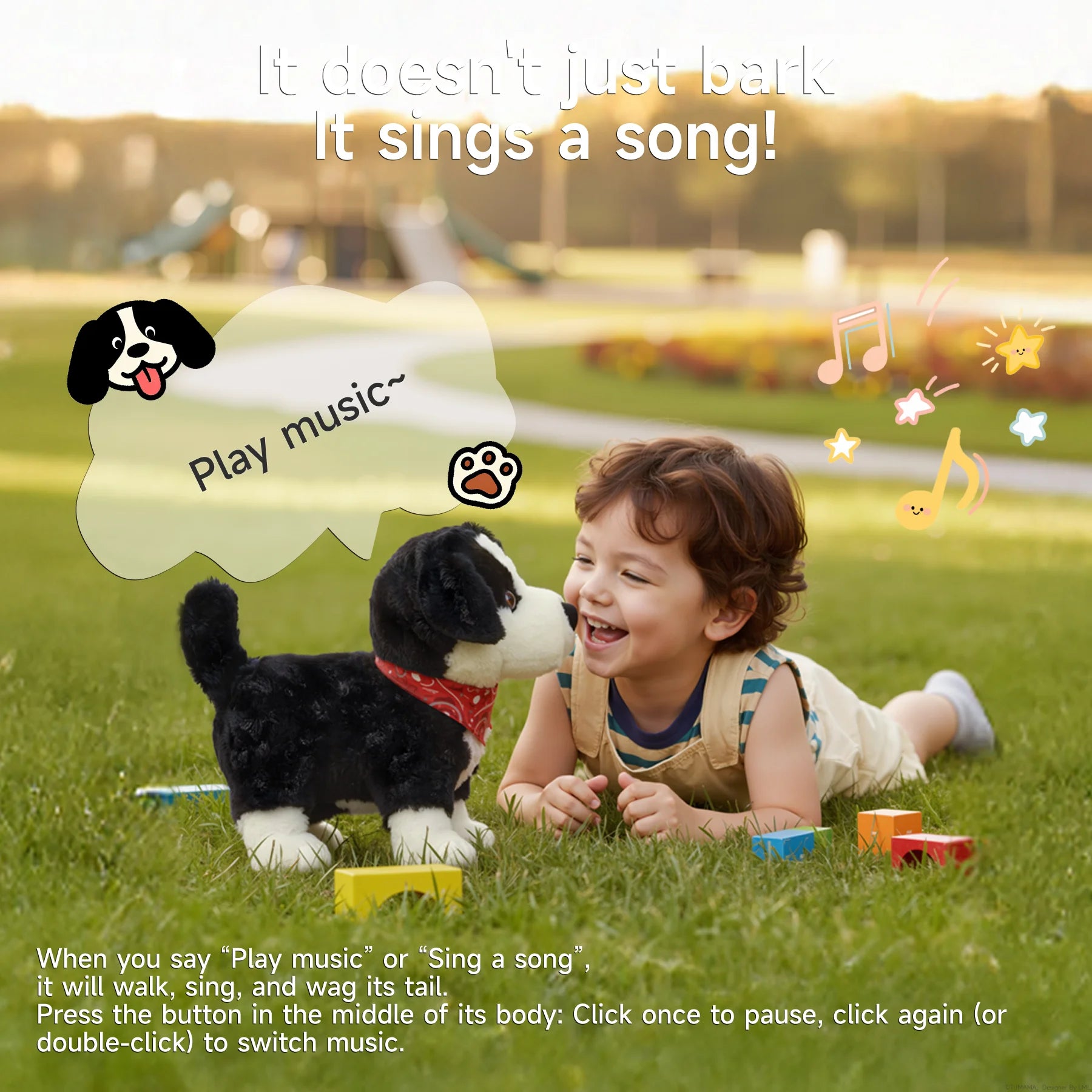 A smiling child lying on the grass playing with a voice-controlled realistic toy dog wearing a red bandana, as the toy responds to the “Play music” voice command and sings a song in the park.