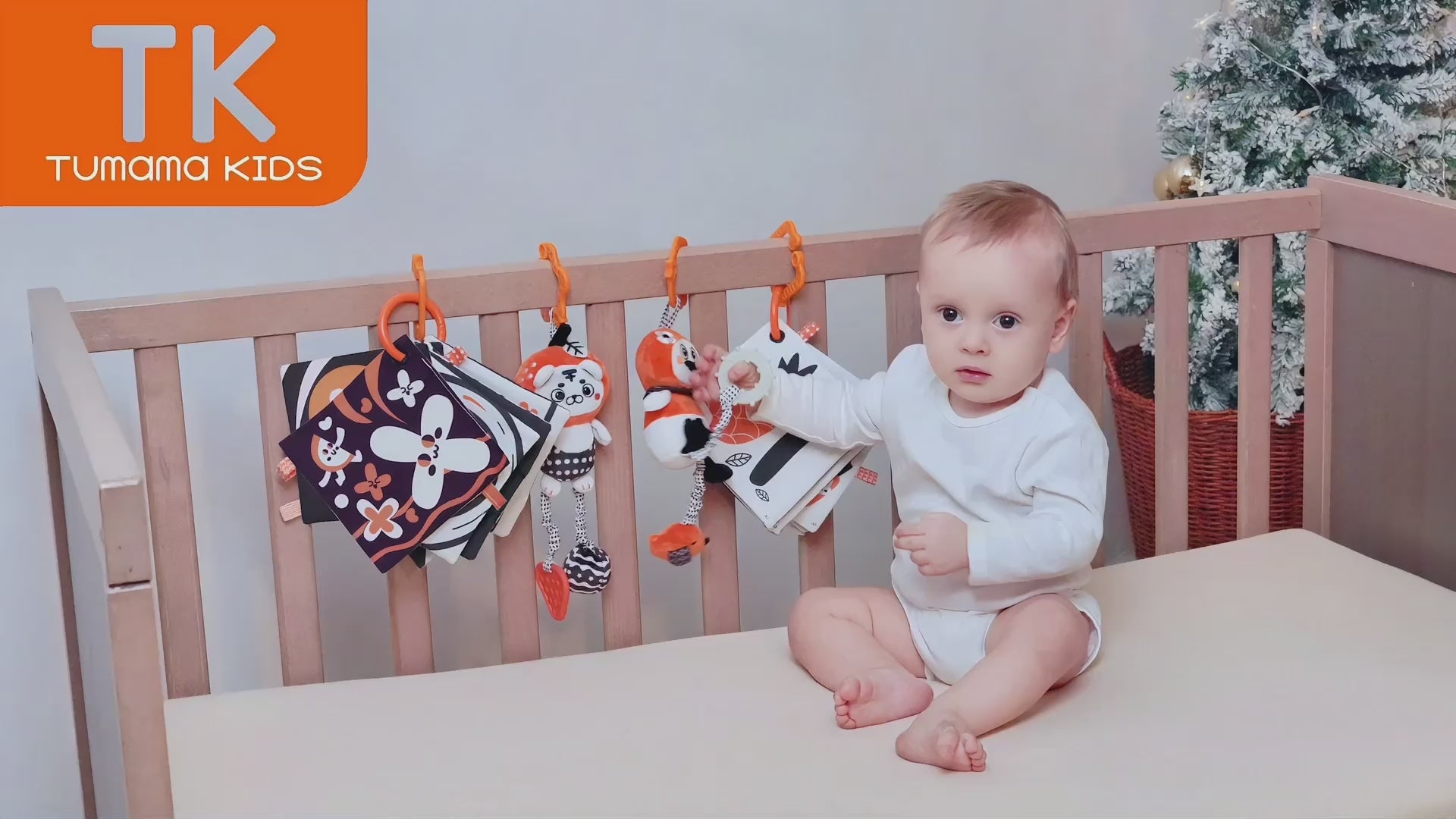 Baby-plays-with-mother-in-stroller-with-high-contrast-black-and-white-hanging-toy