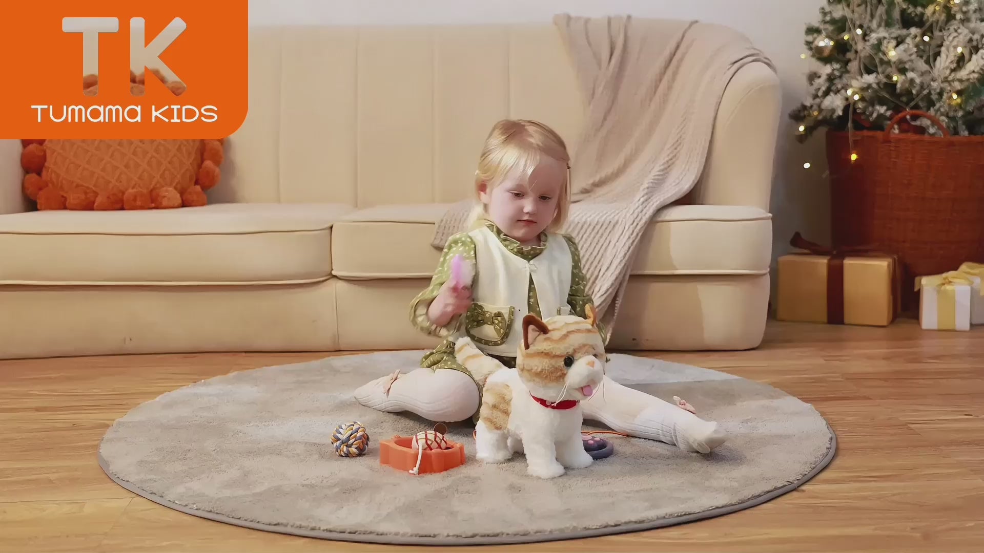 little girl playing with the walking kitty cat toy indoors