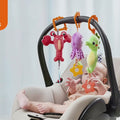 Baby-chews-and-plays-with-soft-seahorse-octopus-and-lobster-toys