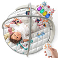 Baby play gym with soft padded mat featuring animal prints, hanging rattles, and a light-up musical keyboard, controlled by a handheld remote.
